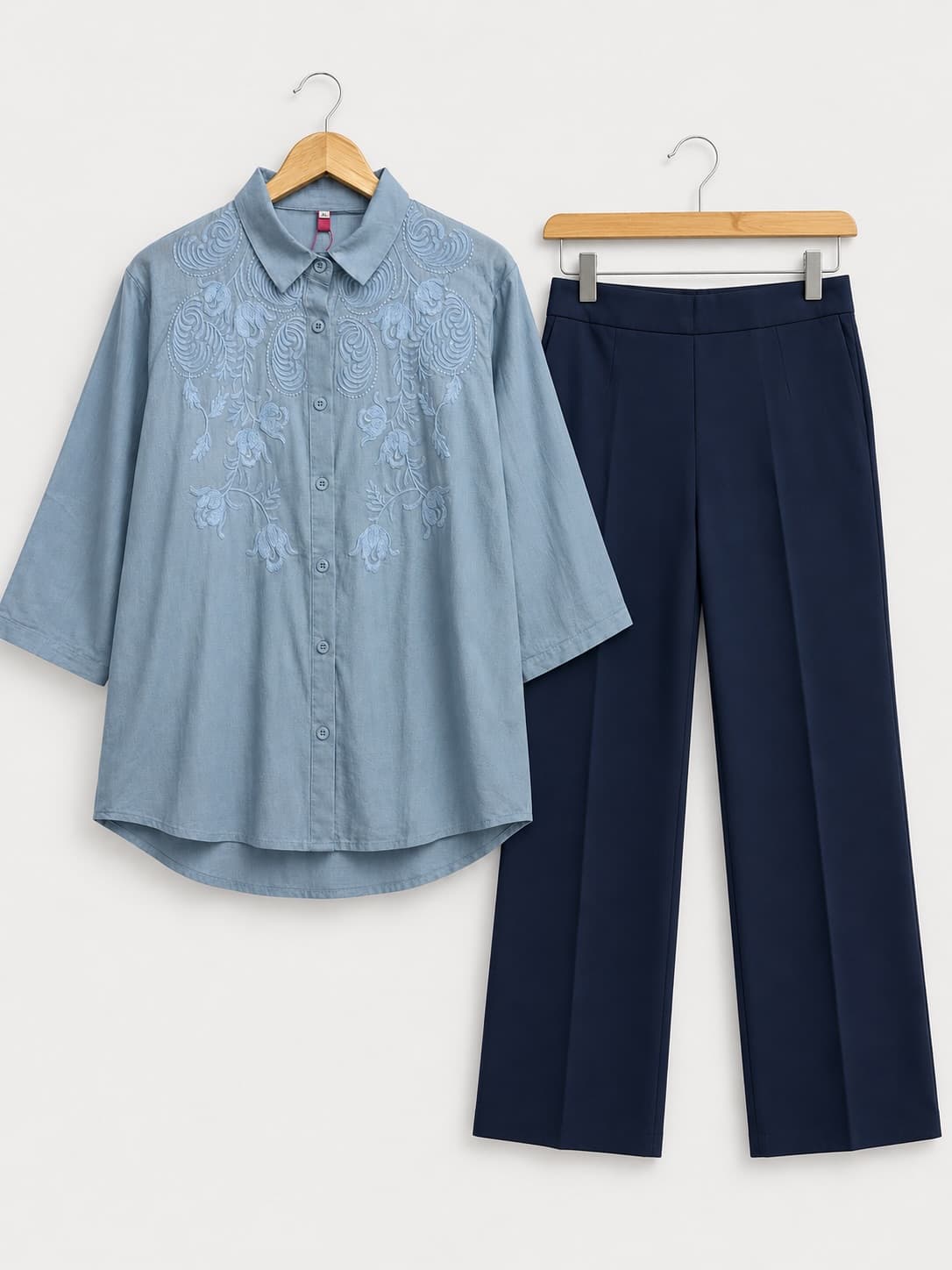 Powder blue embroidered shirt with navy wide-leg trousers