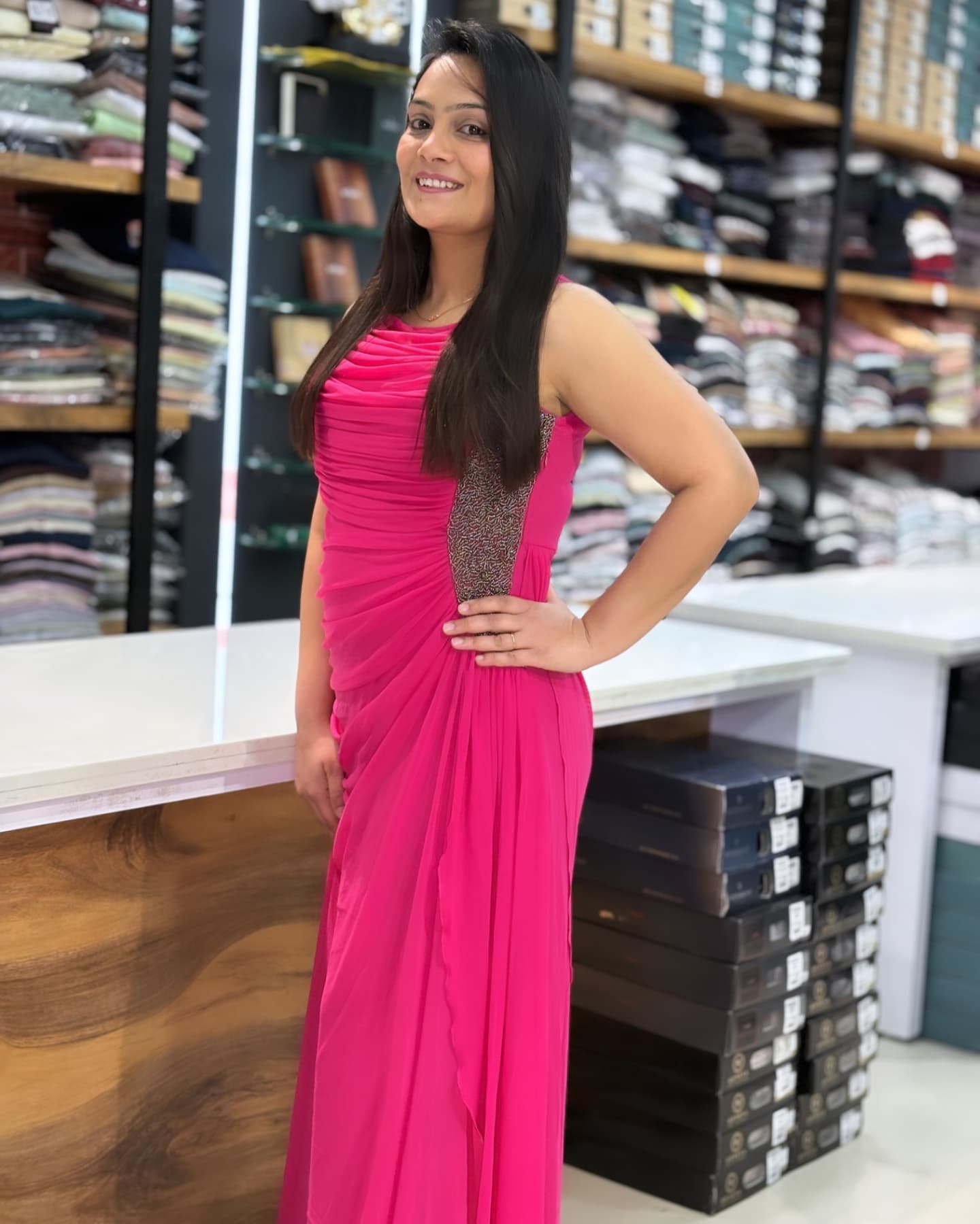 Hot pink draped evening dress worn in the store