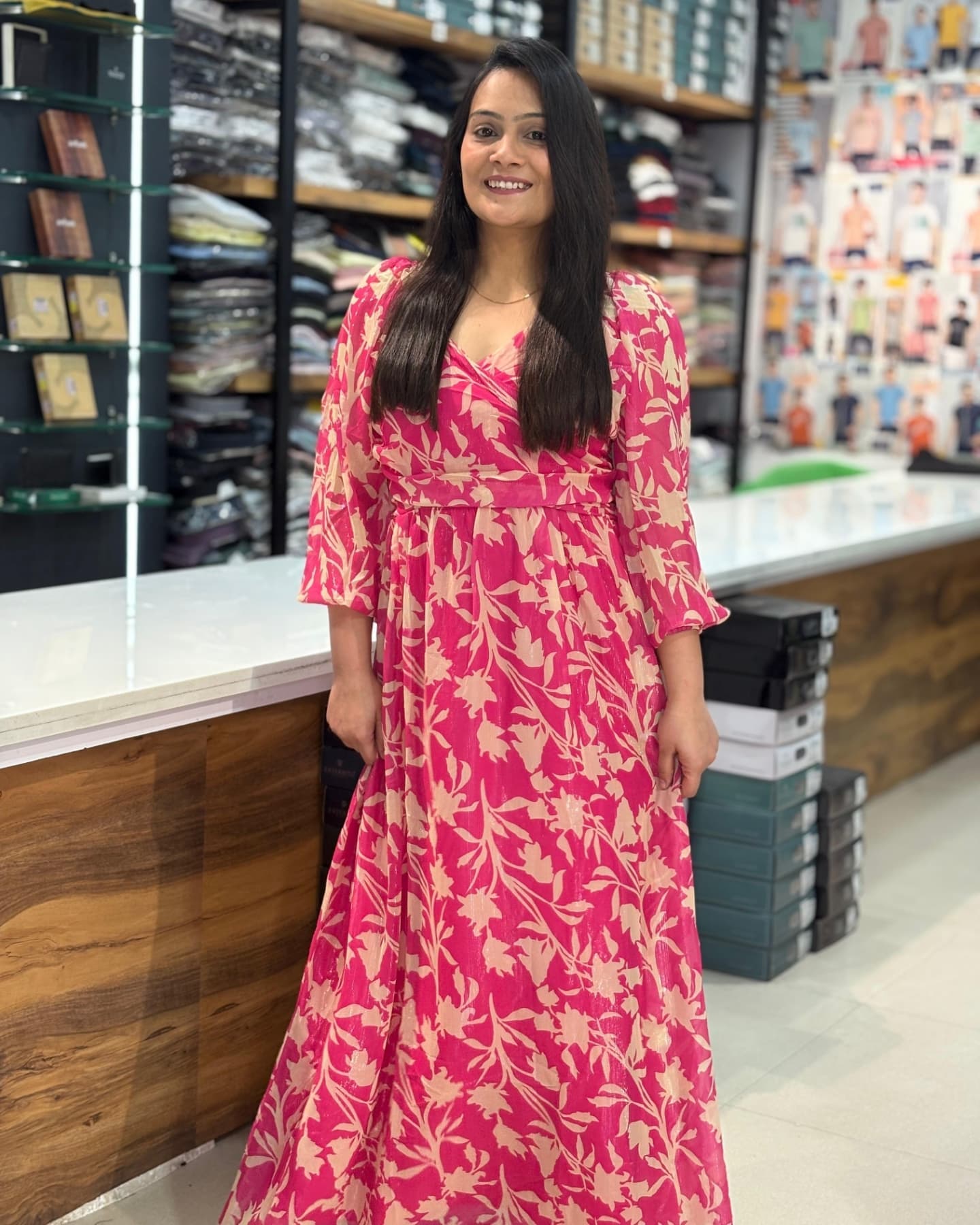 Pink floral print midi dress worn in the store